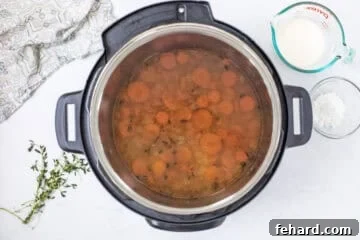Wild rice soup in Instant Pot after being pressure cooked and pressure released before adding cream.