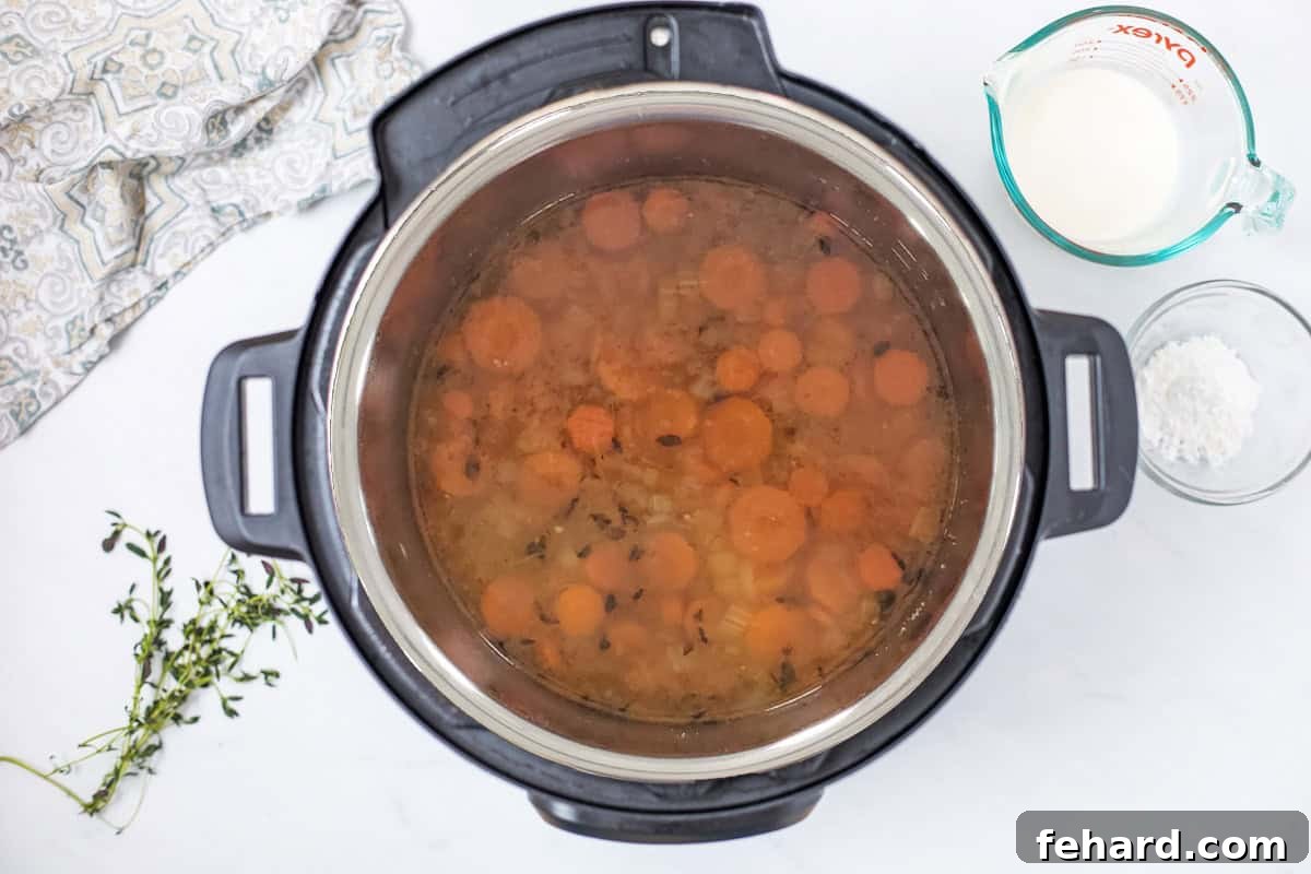 The Instant Pot containing wild rice soup, after the pressure cooking and natural pressure release cycles, before the final creamy finishing touches are added.