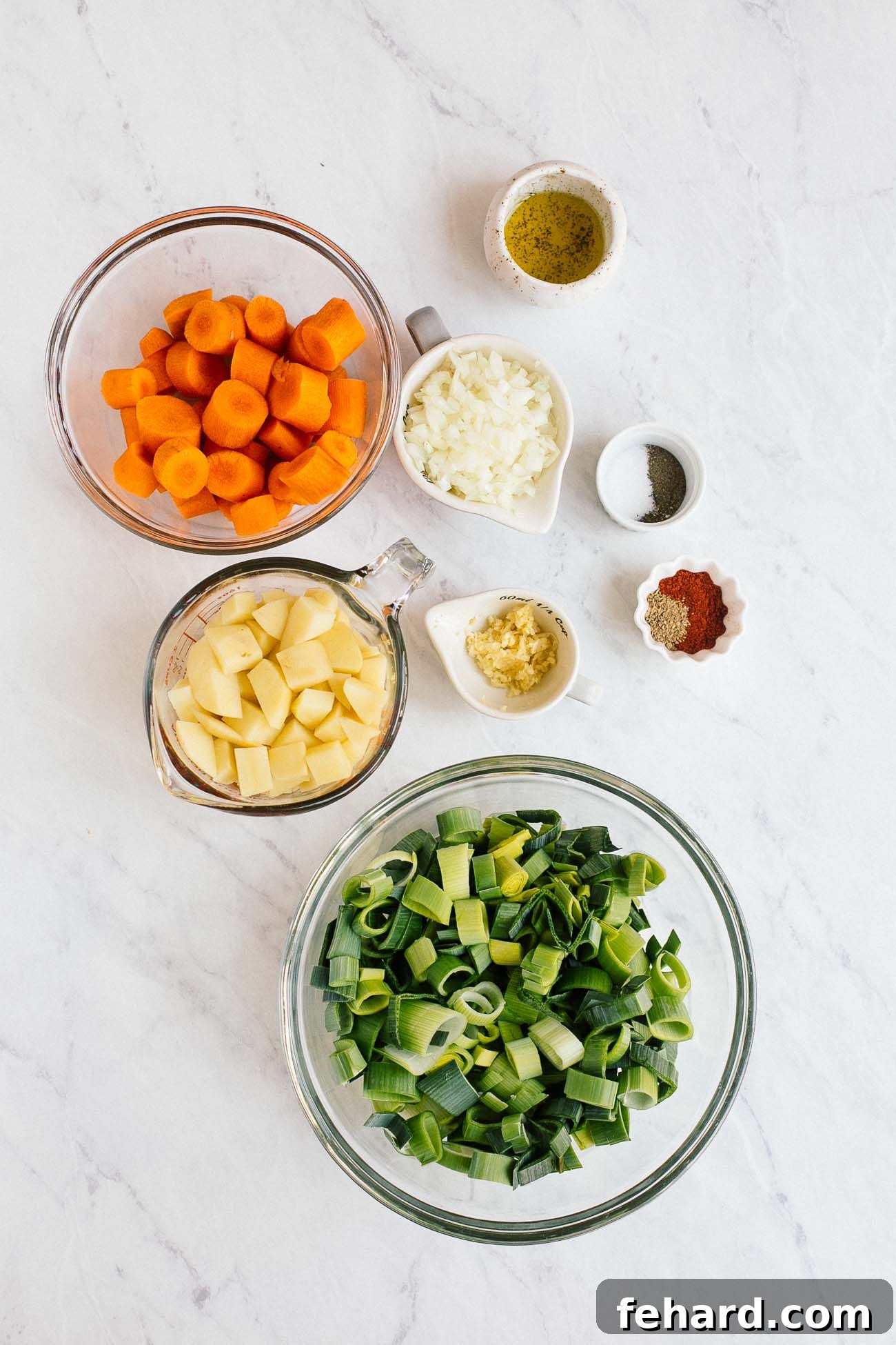 Comforting Carrot Leek Soup 3 Overhead image of ingredients needed to make carrot leek soup.