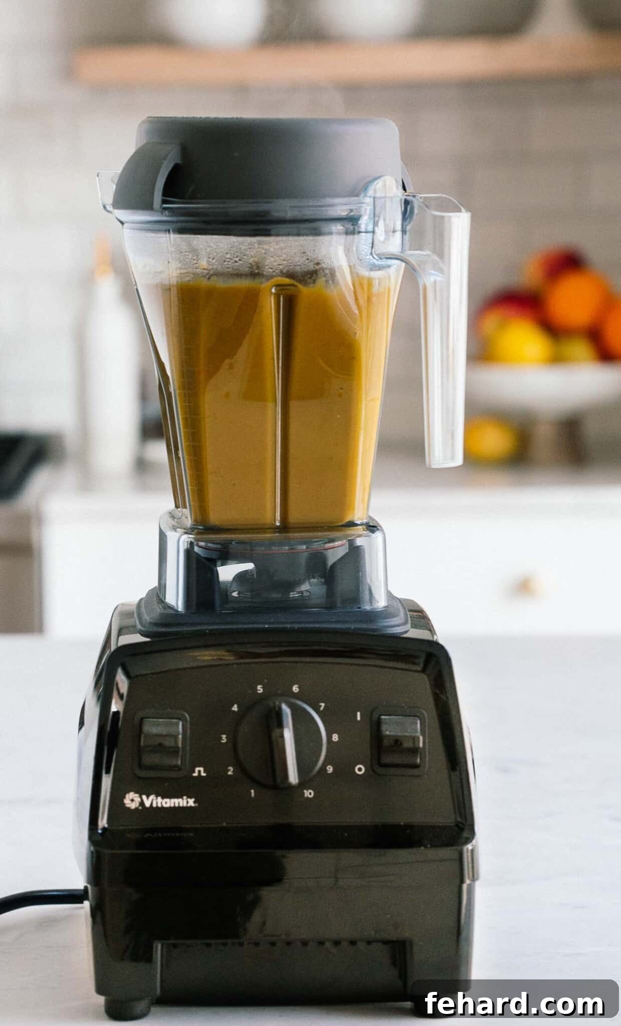 Comforting Carrot Leek Soup 7 Vitamix blender blending up carrot leek soup.
