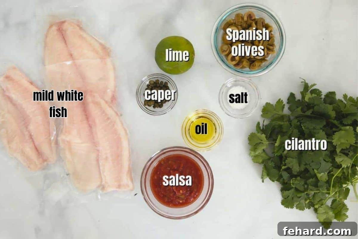 Fish Veracruz Recipe Ingredients Labeled ingredients for Fish Veracruz neatly arranged on a kitchen counter.
