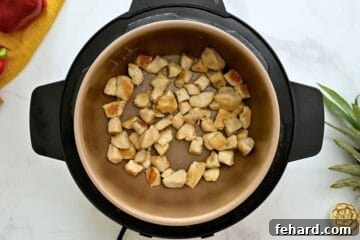 Seared chicken in inner pot for Instant Pot Sweet and Sour Chicken.