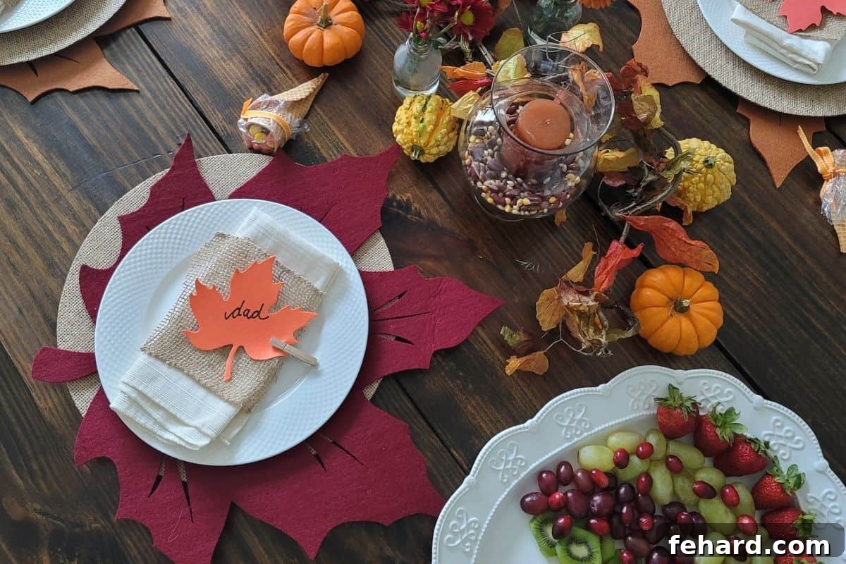 Elegant Thanksgiving Table Setting A beautifully set Thanksgiving table featuring elegant placemats, dinner plates, polished silverware, personalized name cards, and a festive floral centerpiece, evoking warmth and hospitality.
