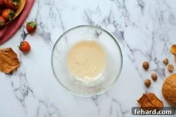 Vanilla glaze in clear mixing bowl.