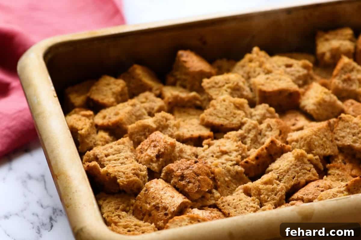 The perfectly baked French Toast Casserole, golden brown and puffed, cooling in its baking dish fresh out of the oven, promising a delightful breakfast experience.