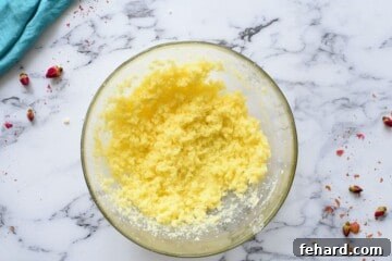 Mixing bowl with creamed butter and granulated sugar.