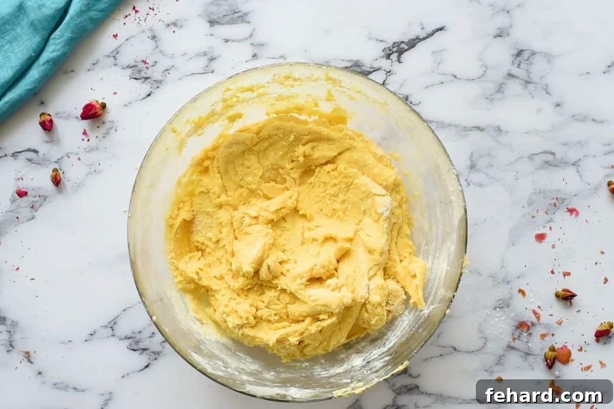 Soft sugar cookie dough expertly mixed in a large bowl, showcasing its perfect consistency.