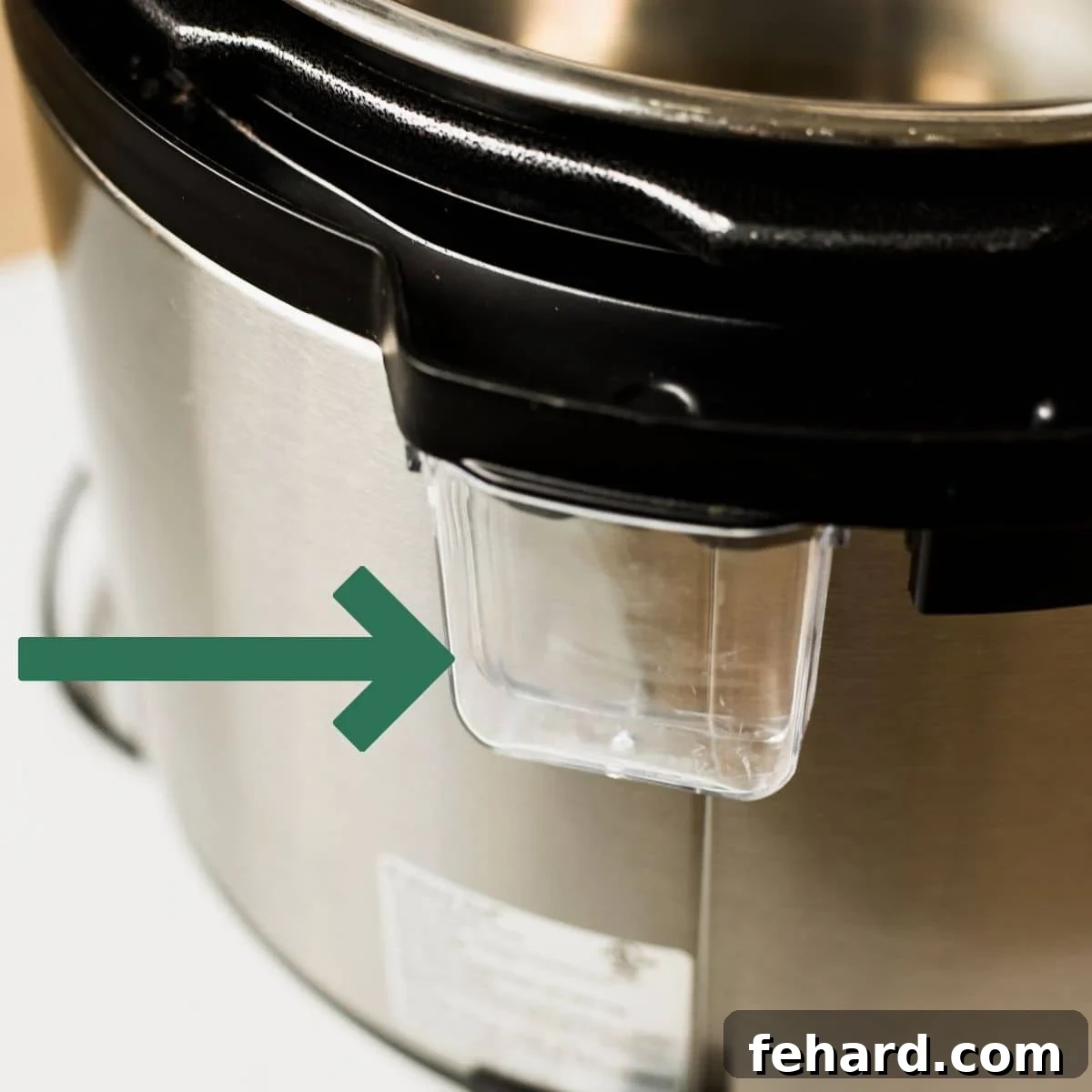 Instant Pot on counter with arrow pointing to condensation cup.