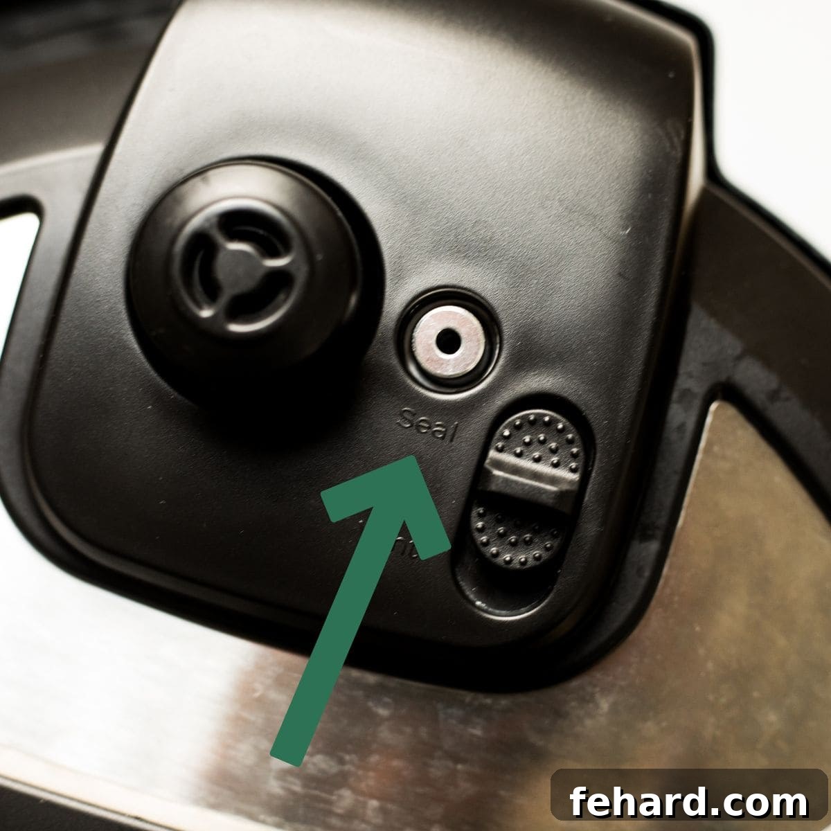 Arrow pointing to venting knob pointed to seal on Instant Pot Duo Plus.