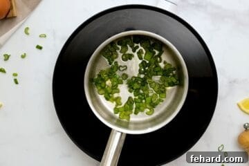 Sauteed green onions in small saucepan.