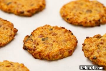 Crispy Baked Tuna Cakes on sheet pan lined with parchment paper.