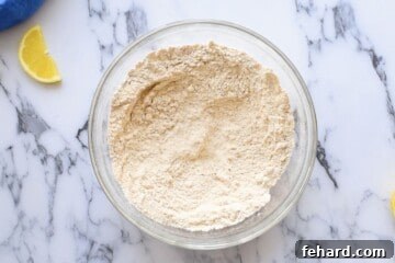 Sifted and whisked dry ingredients for whole wheat pancakes in a large mixing bowl.