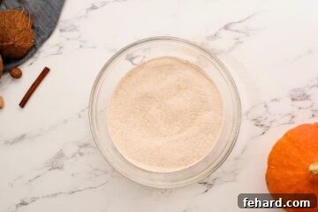 Sifted and whisked whole wheat flour, baking soda, baking powder, salt, and spices together in mixing bowl.