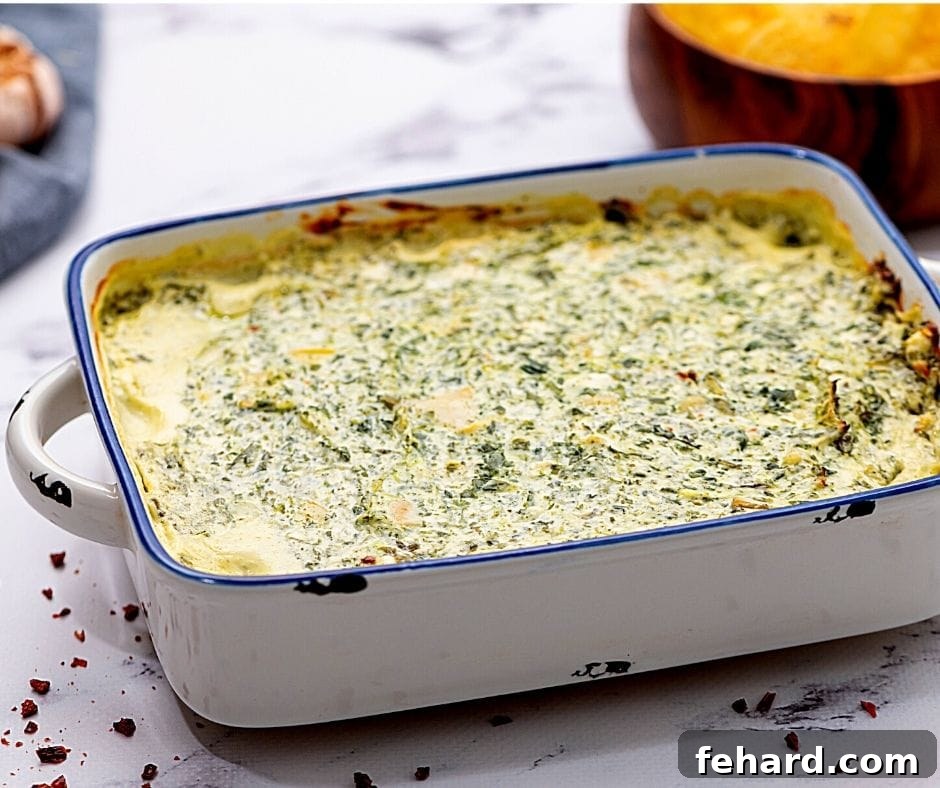 White Baking Dish filled with healthy spinach dip, served with tortilla chips on the side.