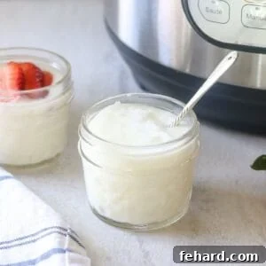 Jar of homemade Instant Pot yogurt next to Instant pot.