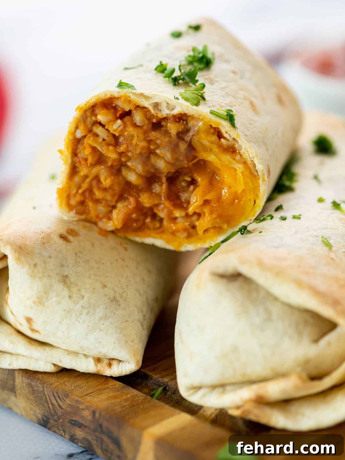 Bean Burrito Bean Burrito cut open to reveal a delicious filling of rice, cheese, and refried beans.