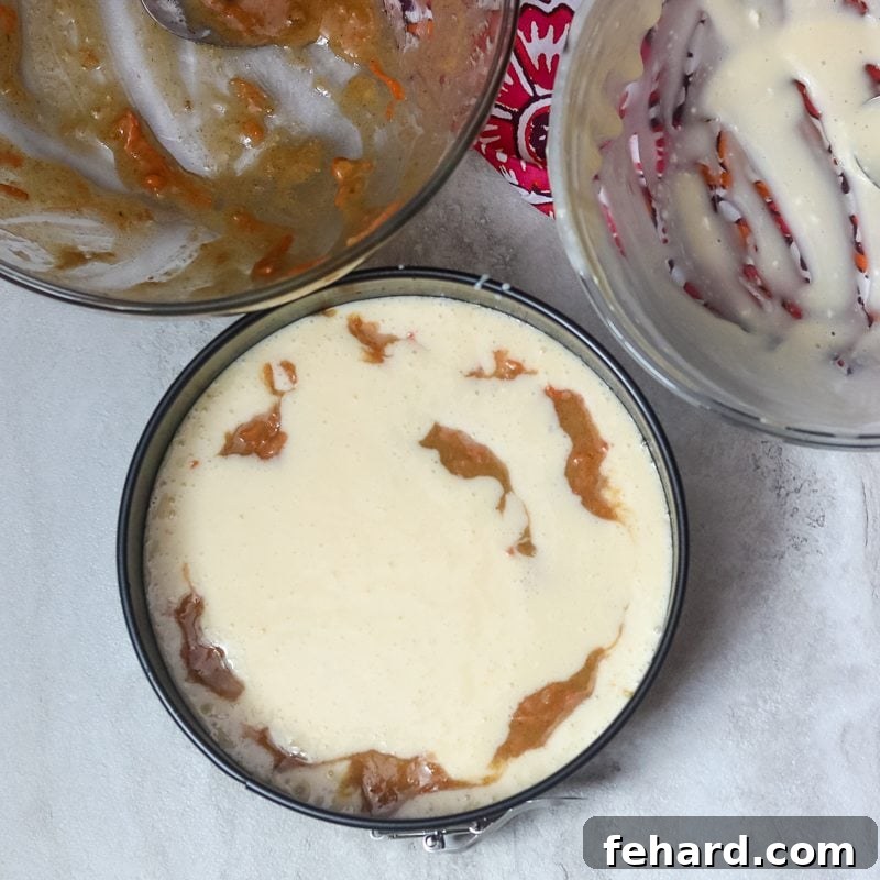Cheesecake and carrot cake batter marbled together in springform pan for pressure cooker