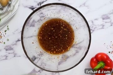 Sesame soy dressing in a small bowl.