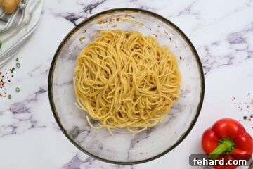 Bowl of noodles with sesame soy dressing.