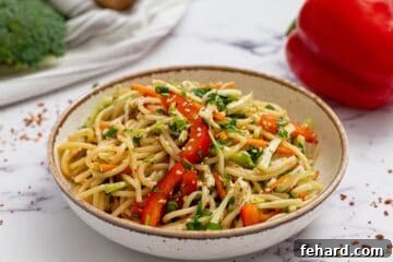 Noodle Salad in bowl topped with sesame seeds.