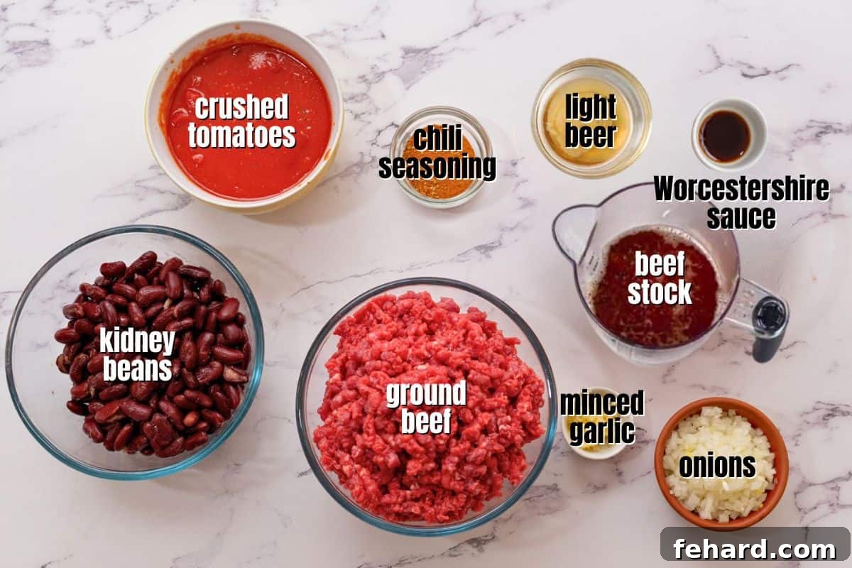 Recipe Instant Pot Chili Ingredients Ingredients for Instant Pot Chili made with beef and beans labeled on counter.