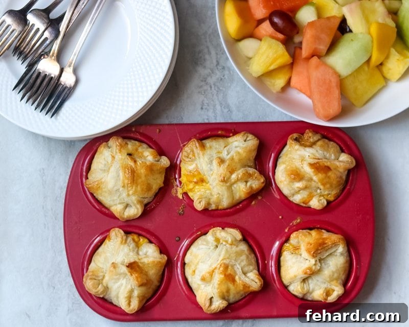 Easy Breakfast Quiche baked in red muffin tin.