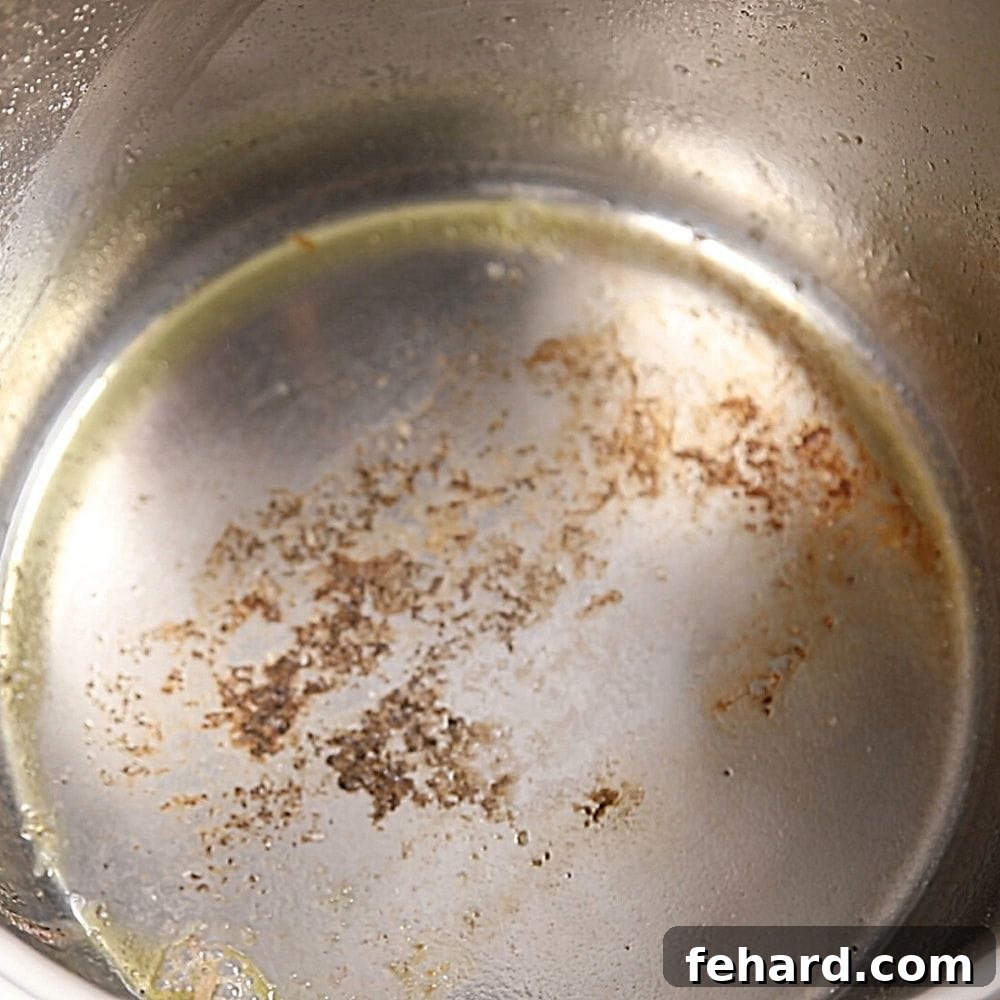 Instant Pot Not Working Burned food on bottom of inner pot, illustrating a common cause for an Instant Pot burn notice.