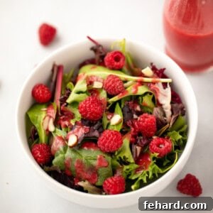 Mixed greens topped with raspberry salad dressing.