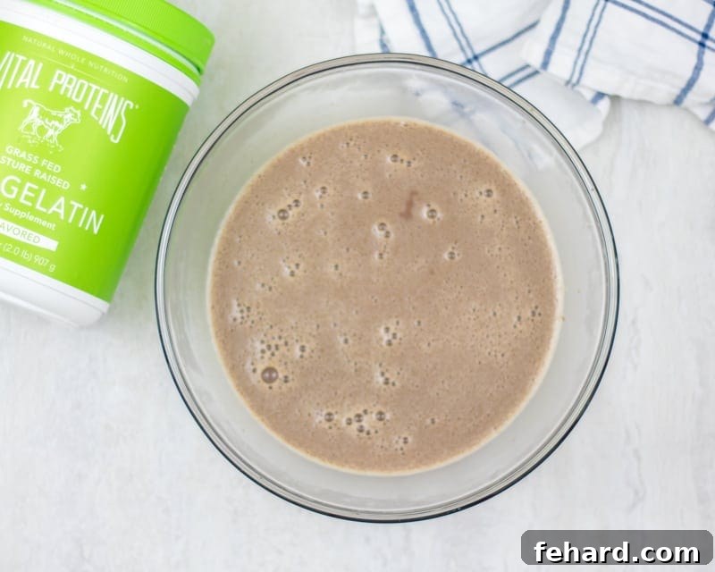 Simple chocolate pudding mixture Smooth, egg-free chocolate custard mixture in a mixing bowl