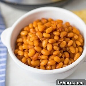 Speedy Instant Pot Baked Beans 3 Instant Pot Baked Beans in White Dish next to Instant Pot.