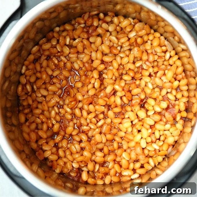 Pressure Cooker Baked Beans Finished Cooked baked beans inside the Instant Pot, showing a rich, dark sauce.