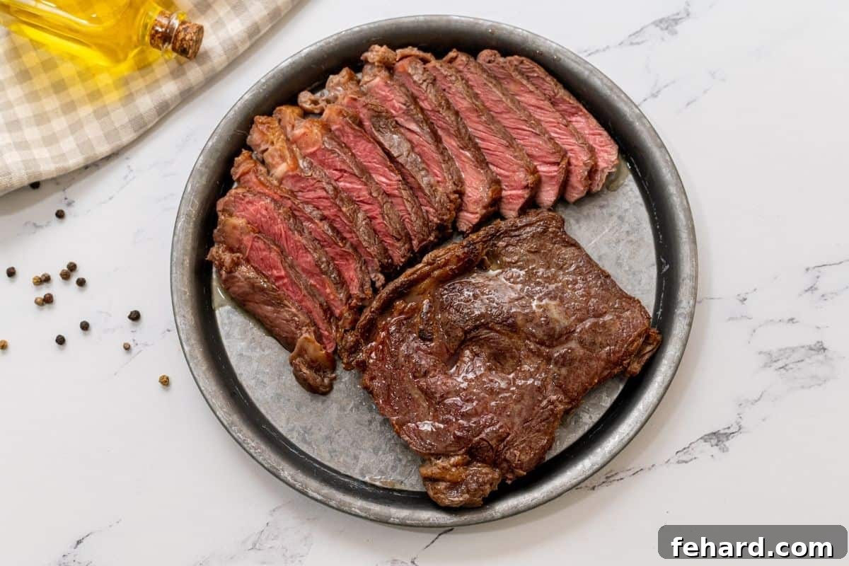 Avoid Cooking Steak in Instant Pot Two perfectly seared ribeye steaks on a platter; one whole, one expertly sliced to show its juicy interior.