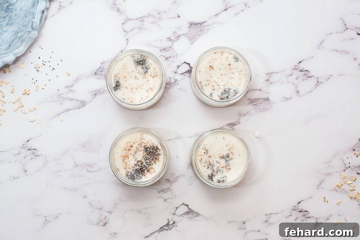 Four jars of overnight oats before refrigeration.