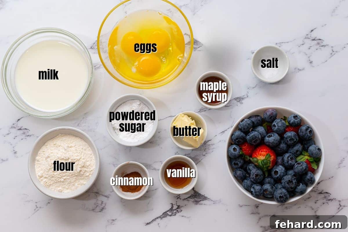 Neatly arranged ingredients for Dutch Baby Pancake, including eggs, milk, flour, butter, vanilla, and cinnamon, measured and labeled on a clean kitchen counter.