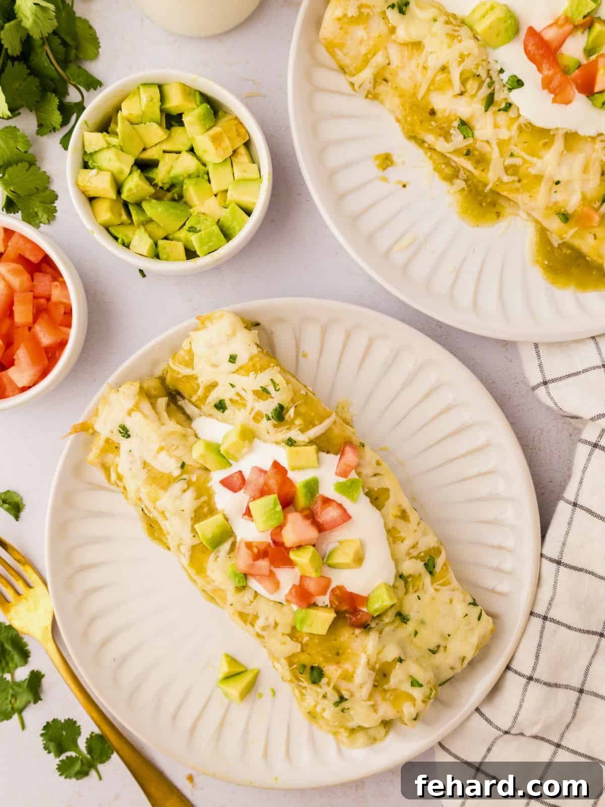 Vibrant green Salsa Verde Chicken Enchiladas on a pristine white plate, beautifully garnished with fresh diced avocado and bright red diced tomatoes, perfectly showcasing their rich, cheesy topping and inviting presentation.