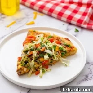 Fiesta Pizza 2 A perfectly crafted Taco Pizza, presented beautifully and ready to be enjoyed with family and friends.