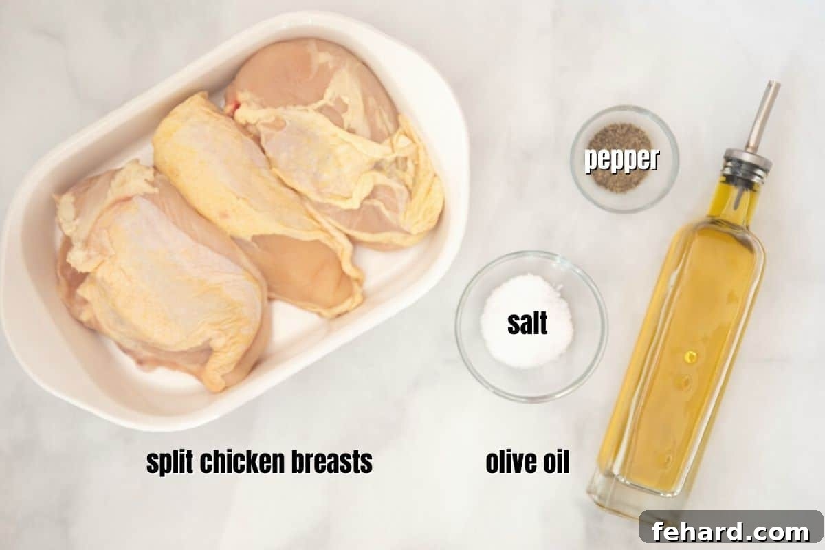 Essential ingredients for split chicken breast: raw chicken, olive oil, salt, and pepper clearly labeled on a kitchen counter.