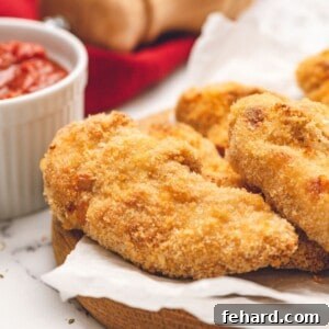Homemade Crispy Chicken Tenders on platter.