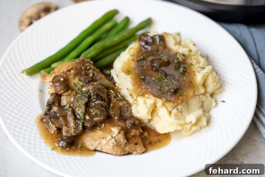 Plated Instant Pot Chicken Marsala served with potatoes and green beans