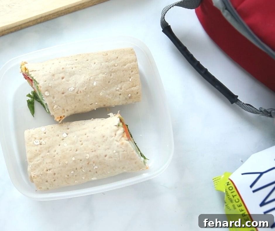 Nut-Free Kid-Friendly Recipes: Ranch Veggie Wrap Ranch Vegetable Wrap in a lunchbox container, showcasing a vibrant and appealing nut-free veggie meal.