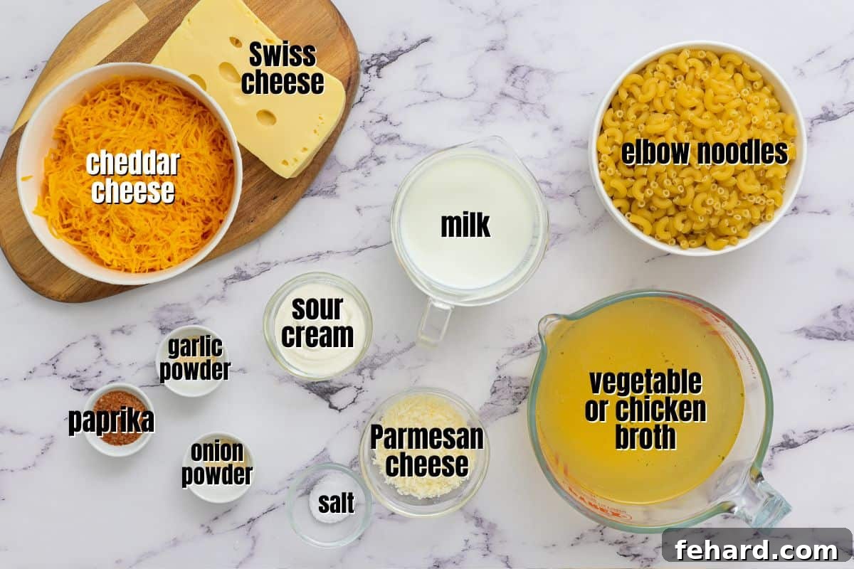 A selection of fresh, high-quality ingredients for Instant Pot Mac and Cheese, including various cheeses, elbow pasta, and seasoning jars, neatly arranged on a kitchen counter.