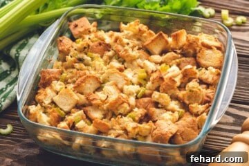 Baked bread stuffing in a large baking dish, golden and ready to serve.