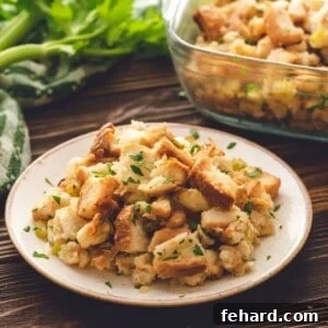 Classic Bread Stuffing dished out on plate, showing its inviting texture.