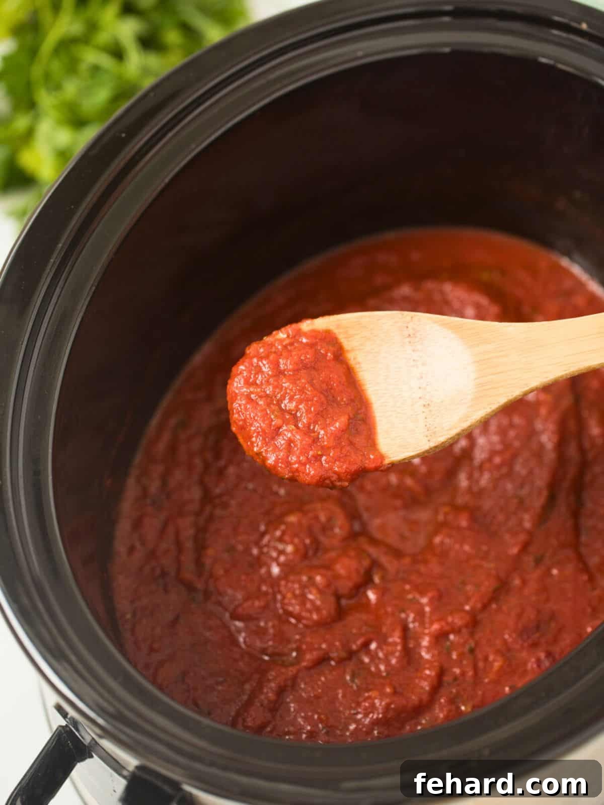 Crockpot Spaghetti Sauce Rich Crockpot Spaghetti Sauce made with canned tomatoes simmering in a slow cooker.