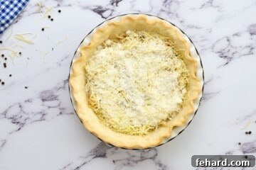 Bacon, cheese, and onions layered into prebaked pie crust.