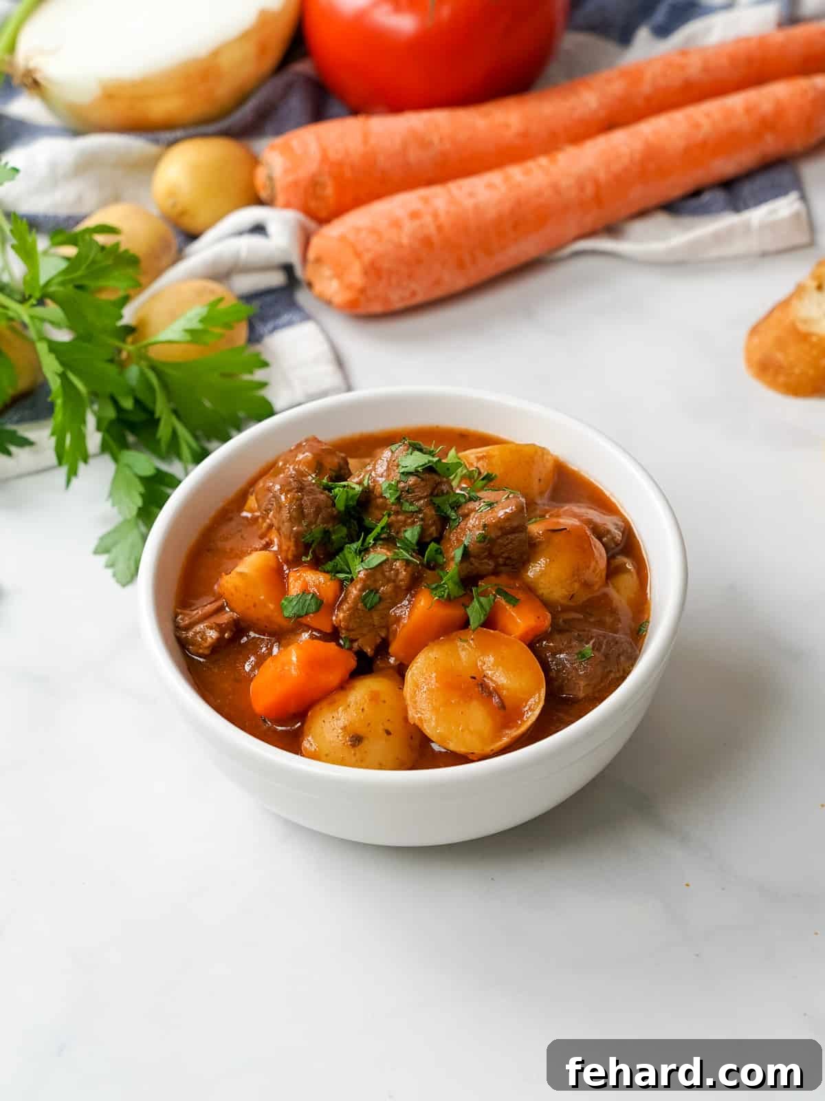 A steaming bowl of Instant Pot beef stew, garnished with fresh herbs, showcasing tender beef, vibrant potatoes, and carrots in a rich, dark broth.