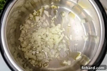 Fast & Flavorful Instant Pot Spaghetti 4 Onions sauteed in inner pot for spaghetti sauce.