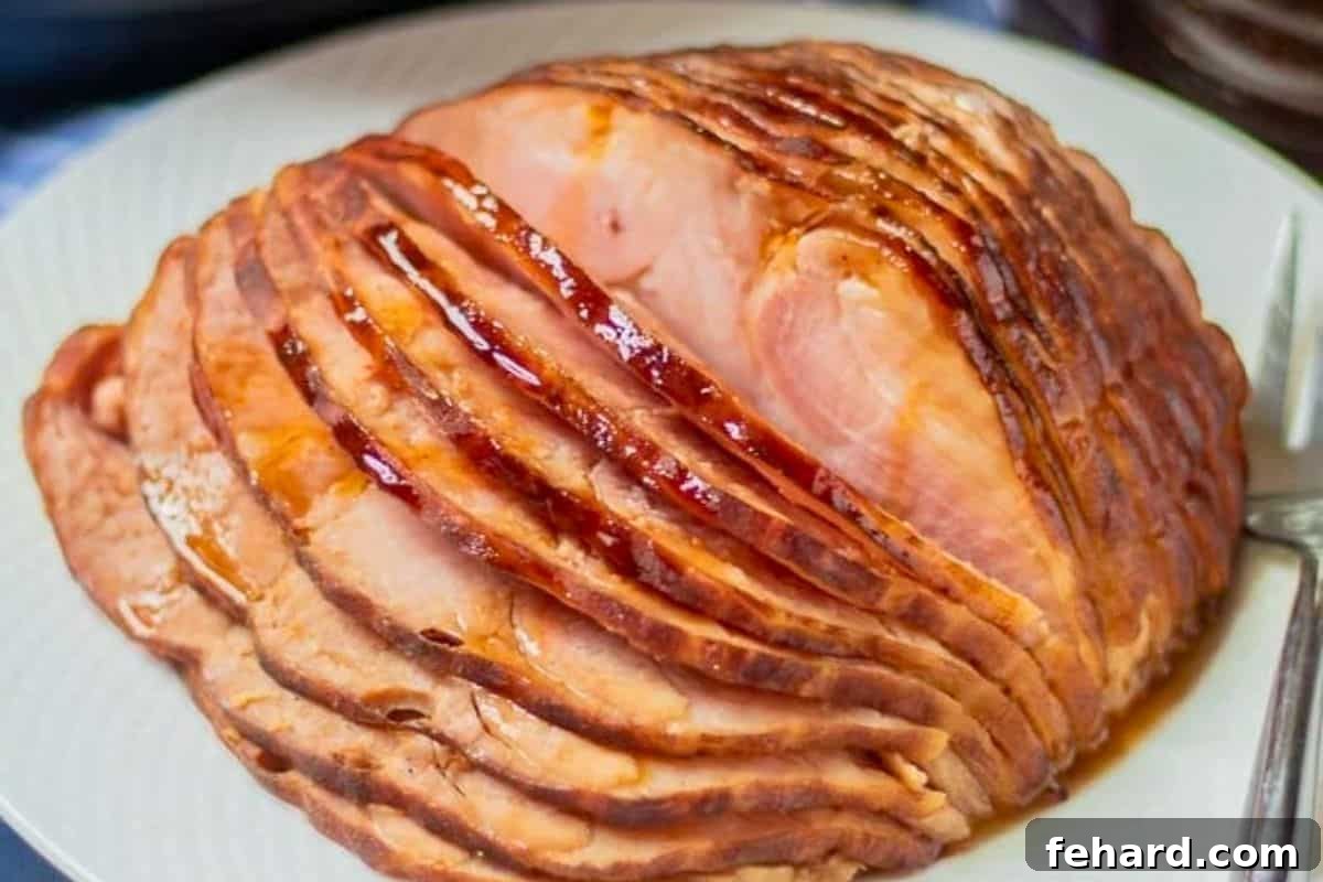 Instant Pot Spiral Sliced Ham Serving Suggestion Beautifully sliced Instant Pot ham arranged on a pristine white platter, glistening with its honey and pineapple glaze.