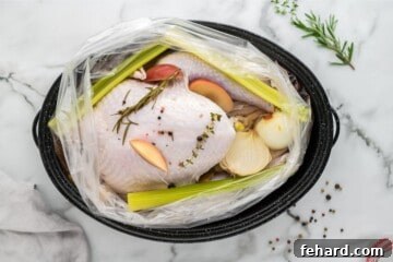 Effortless Turkey Brine for a Juicier Bird 5 Raw turkey in brine bag along with herbs and onions.