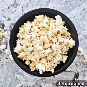 Homemade Microwave Popcorn in black bowl.